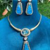 Blue Stone Kundan Necklace Set with peacock motif and earrings.