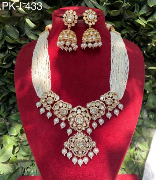 Bridal Kundan choker set with Mozonite stones and pearl drop jhumkas.