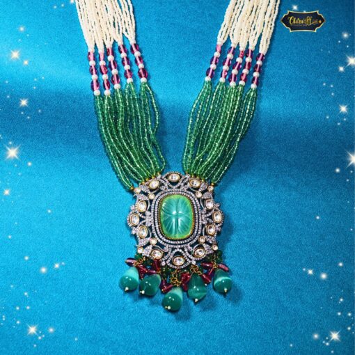 Emerald Blossom Necklace Set with carved emerald pendant and multi-strand green bead necklace, styled for bridal and festive Indian wear.