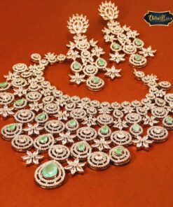 Royal Bloom Set featuring teardrop gemstones and intricate floral motifs in a coordinated necklace and earring design.