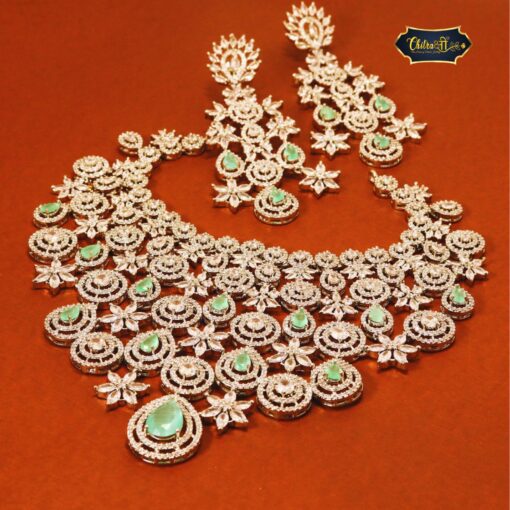 Royal Bloom Set featuring teardrop gemstones and intricate floral motifs in a coordinated necklace and earring design.
