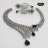 Emerald Bloom Radiance Necklace Set featuring green stones and floral motifs with matching earrings, perfect for festive and elegant occasions.