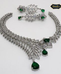 Emerald Bloom Radiance Necklace Set featuring green stones and floral motifs with matching earrings, perfect for festive and elegant occasions.