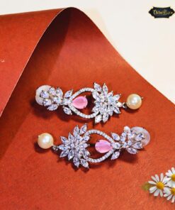 Petal Sparkle & Pearl Dangle Earrings featuring delicate pearls and floral accents, perfect for elegant and feminine looks.