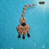 Celestial Nightfall Mang Tika – Traditional gold-toned hair jewelry with intricate design and gemstone detailing for festive and bridal wear.