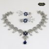 Blue Royal Necklace Set featuring teardrop charm and floral motif with sparkling crystal accents and matching earrings
