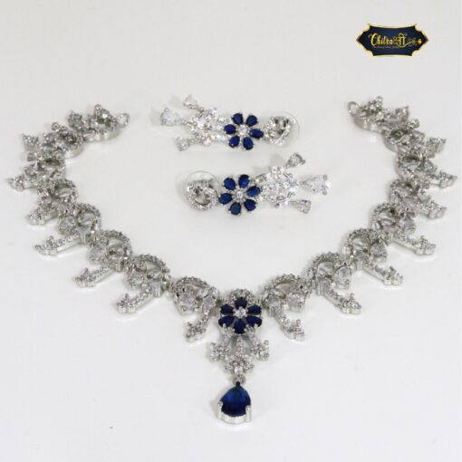 Blue Royal Necklace Set featuring teardrop charm and floral motif with sparkling crystal accents and matching earrings