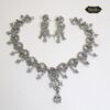 Snowdrop Radiance Necklace Set featuring a delicate floral design and icy teardrop accent with matching earrings
