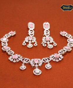 Rose Glow Necklace Set in baby pink and silver tones featuring a delicate necklace and matching earrings for a subtle, elegant look.