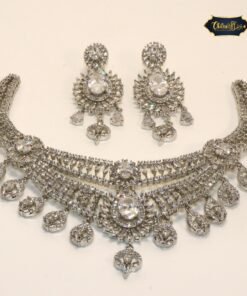 Arctic Sparkle Set featuring icy-toned necklace and earrings with ornate embellishments for a refined, radiant look.