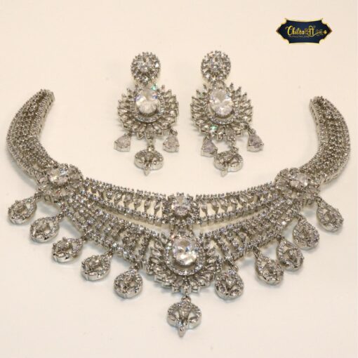 Arctic Sparkle Set featuring icy-toned necklace and earrings with ornate embellishments for a refined, radiant look.