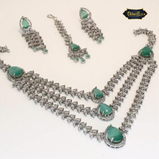 Aqua Bridal Set featuring a teardrop necklace, matching earrings, and delicate maang tikka with shimmering aqua stones