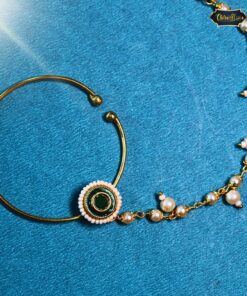 Designer Circular Nath featuring green Kundan center and pearl drop, a perfect traditional nose ring for ethnic and bridal wear.