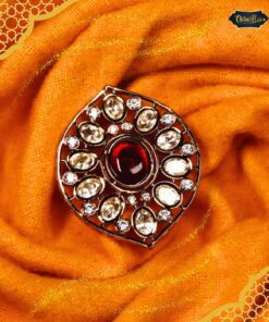 Maharani Ruby Halo Ring featuring a vibrant central ruby surrounded by a sparkling halo of accent stones in an elegant setting