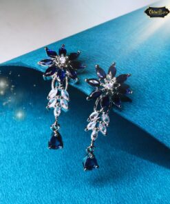 Elegant navy blue stone dangler earrings with a festive design and intricate detailing for weddings and cultural celebrations.