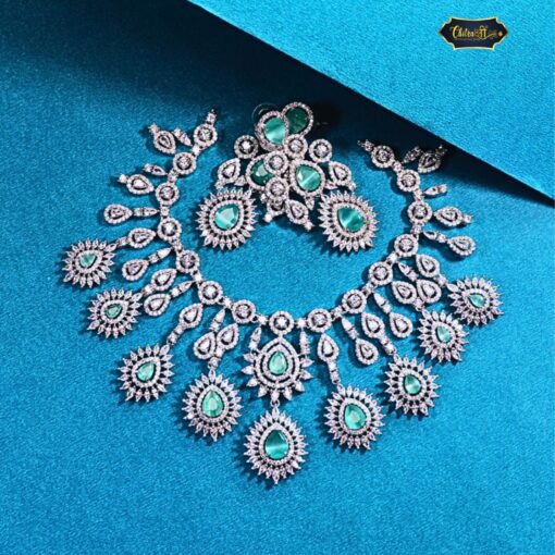 Heavy Bridal Statement Necklace Set with drop stones, matching earrings, and maangtika in a traditional Indian wedding design.