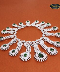 Emerald Bridal Set featuring a green teardrop necklace and matching earrings with a silver finish, ideal for elegant bridal wear.