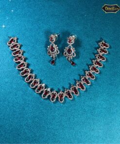 Statement red stone choker with matching earrings featuring bold red gemstones and intricate detailing, ideal for Indian weddings and festive wear.