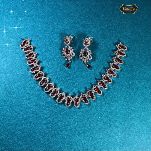 Statement red stone choker with matching earrings featuring bold red gemstones and intricate detailing, ideal for Indian weddings and festive wear.