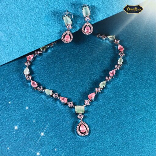 Pastel Dream Jewelry Set with soft pink and green stones featuring a delicate necklace and matching earrings on a neutral background.