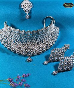 Teardrop-style necklace set with sparkling stones, paired with matching maangtika and earrings, ideal for bridal and festive wear.