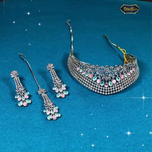 Pastel bloom diamond choker set with pink and mint green bridal earrings and maang tikka