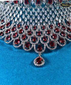 Royal Crimson Drop Choker featuring ruby teardrop stones and intricate detailing, paired with matching earrings for a regal and elegant look.
