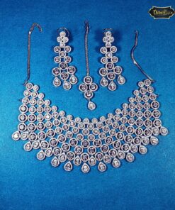 Eternal Glimmer Necklace Set with layered round and teardrop stones, paired with matching earrings—ideal for elegant, festive, or bridal looks.