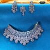 Elegant silver tone wedding jewelry set with necklace, earrings, and maangtika in diamond look design