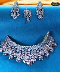 Elegant silver tone wedding jewelry set with necklace, earrings, and maangtika in diamond look design