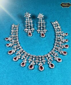 Crimson Radiance Necklace Set with teardrop ruby stones and floral motifs, including matching earrings—ideal for weddings, parties, and elegant festive looks.