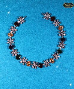 Red Teardrop Jewelry Set with diamond-look stones, matching earrings, and maang tika for bridal or festive wear.