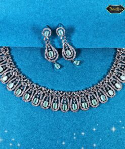 Pastel green oval stone necklace set with looped design and matching earrings, ideal for festive and wedding wear.