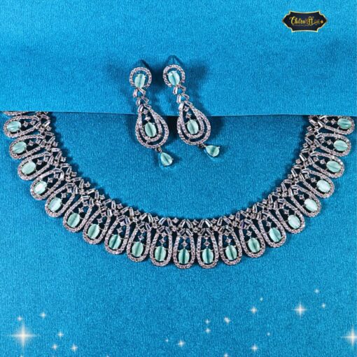 Pastel green oval stone necklace set with looped design and matching earrings, ideal for festive and wedding wear.