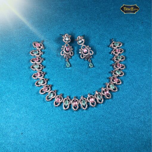 Pastel Sparkle Necklace Set featuring pink and green stones for weddings and parties, including earrings and bracelet in elegant pastel tones.