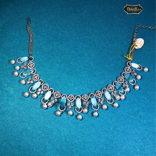 Ocean Breeze Necklace with icy blue stones and pearl dangles, perfect for beach weddings, summer looks, and ocean-inspired fashion.