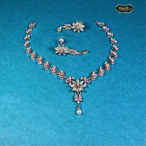 Mint green vine and floral necklace set with matching earrings in gold-toned base