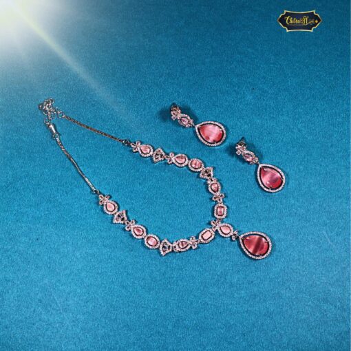 Rose Blush Statement Necklace Set – rose‑gold sparkling drop pendant and matching earrings on display