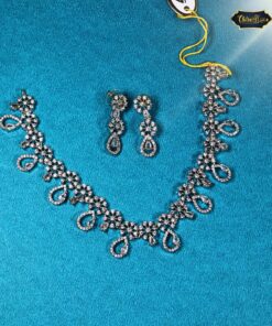 Silver zircon necklace set with paisley and floral motifs and matching drop earrings