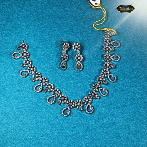 Silver zircon necklace set with paisley and floral motifs and matching drop earrings